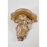 A C19th carved gilt wood wall bracket, carved as an acanthus leaf, 12" long x 13" wide x 7" deep