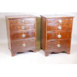 A pair of mahogany chests of four long drawers, with brass 'Trafalgar' plate handles, raised on