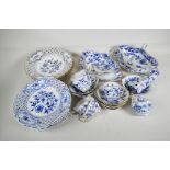 A part service of Meissen Onion pattern tea and dinner ware to include pierced rim plates, gravy