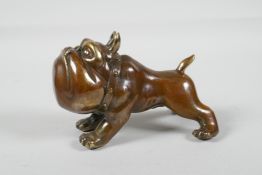 A filled bronze weight in the form of a carton bulldog, 5½" long