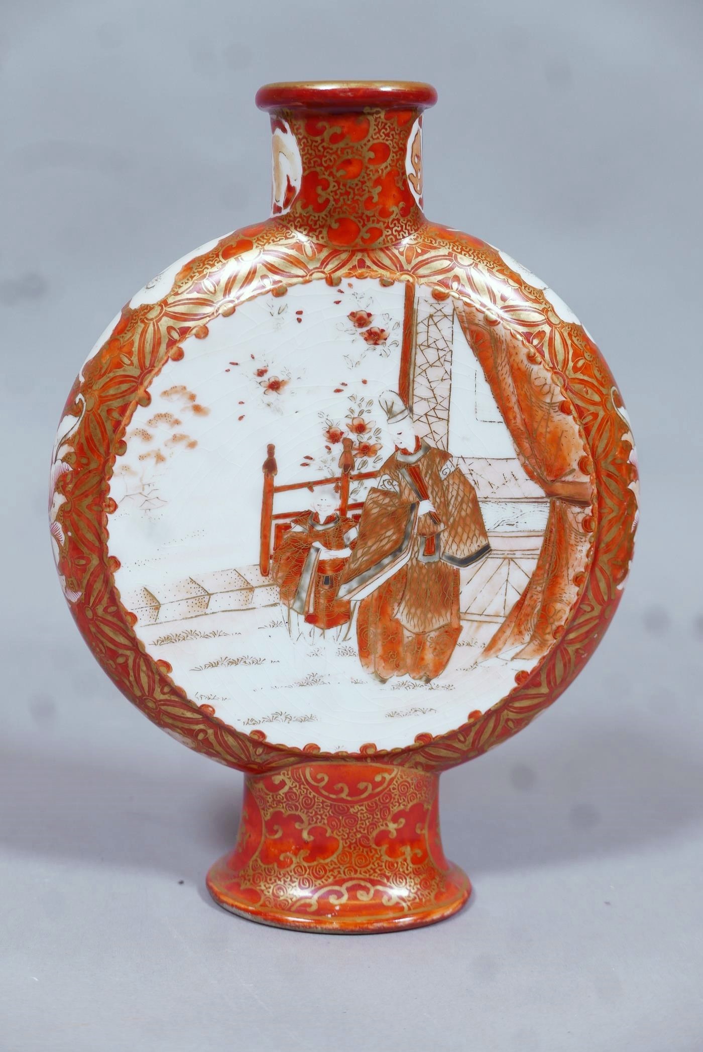 A Meiji Kutani moonflask, one side painted with figures in a garden, the other with cherry