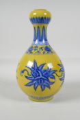 A yellow ground porcelain garlic head shaped vase, with blue & white floral decoration, Chinese,