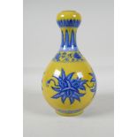 A yellow ground porcelain garlic head shaped vase, with blue & white floral decoration, Chinese,