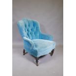 A Victorian button back easy chair in blue velvet, 34" high