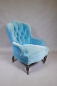 A Victorian button back easy chair in blue velvet, 34" high