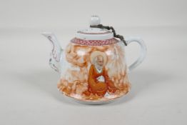 A Republic period porcelain tea pot, decorated with a red robed Lohan, character inscription verso