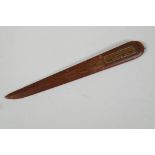 A wood letter opener, bears label 'From the teak of H.M.S. Iron Duke, Admiral Jellicoes Flag Ship,