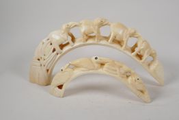 A warthog tooth, carved as a chain of elephants. 15" wide, and another carved as birds and snake