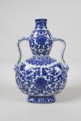 A Chinese blue and white porcelain double gourd flask with two handles and scrolling lotus flower