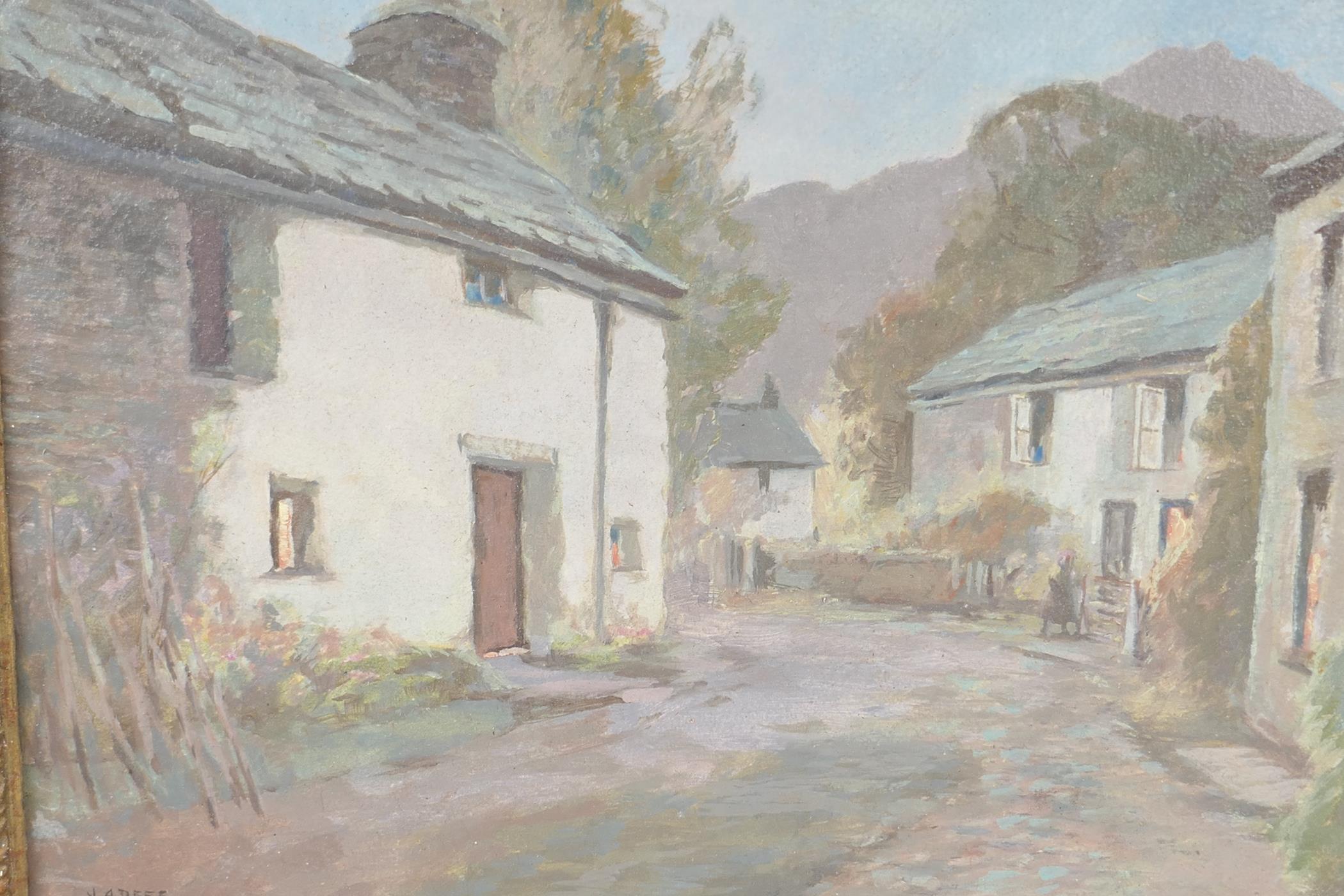 J.A. Dees, a village street scene, entitled verso "Twilight Grange in Barrowdale Lake District",