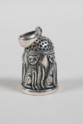 A sterling silver pendant thimble with raised cat decoration, 1" high