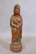 A carved softwood figure of Quan Yin with polychrome and parcel gilt decoration, 24" long