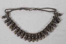 An African white metal tribal necklet, 15½" long