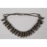An African white metal tribal necklet, 15½" long