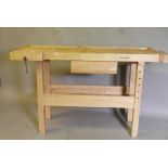 A Whitegate beechwood carpenter's  workbench, with pull out drawer and two vices, 55" x 22" x 34"