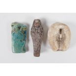 An Egyptian Faience pottery token in the form of Horus, together with a brown glazed Shabti and a