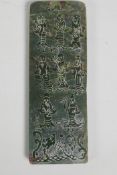 A Chinese green hardstone tablet with carved decoration of the eight immortals and character