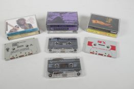 A collection of retro casette tapes, including U2, Radiohead & Oasis bootlegs, 4½" x 3"