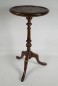 A mahogany pedestal wine table, 20" high x 10" diameter