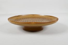 A Song style brown ground pottery dish, with a lobed rim & raised pot, the bowl with chased