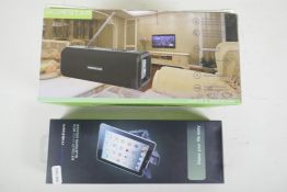 An Audio Motion Tablet stand with bluetooth speaker, and a Hopestar remote speaker, both boxed