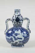 A Ming style blue & white porcelain two handled flask with lotus flower & dragon decoration, 4