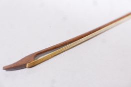 An antique violin bow with swan tip and ebony frog, possibly C18th/early C19th, 27½" long