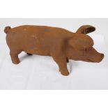 A cast iron garden figurine of a pig, 17" long