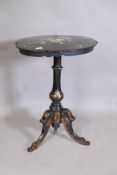 A Victorian papier mache tilt top occasional table with Mother of Pearl inlay and parcel gilt