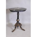 A Victorian papier mache tilt top occasional table with Mother of Pearl inlay and parcel gilt