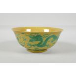 A Chinese yellow ground porcelain rice bowl with incised green enamel dragon decoration, 6 character