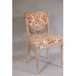 An Italian neo classical style painted and parcel gilt side chair, with carved swag back, raised