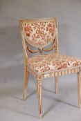 An Italian neo classical style painted and parcel gilt side chair, with carved swag back, raised