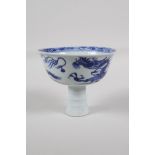 A Chinese black & white porcelain stem cup, decorated with a dragon chasing the flaming pearl, 3½" h