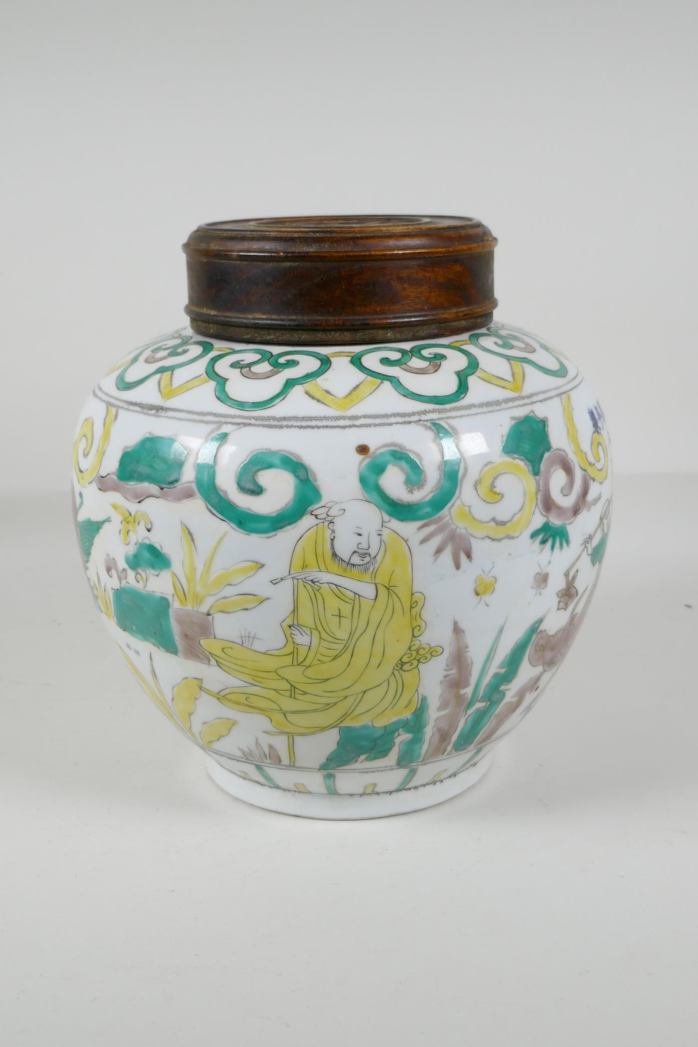 A Chinese Sancai glazed porcelain ginger jar with a turned wood cover, decorated with figures riding - Image 5 of 8