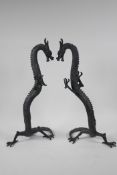 A pair of Chinese bronze figurines of dragons, 16" high