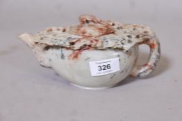 A Chinese carved soapstone teapot, the knop carved as a sleeping bird, 8" x 3"