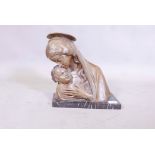 A terracotta bust of the Madonna and Child, mounted on a marble base, inscribed G. Carli, 13" high