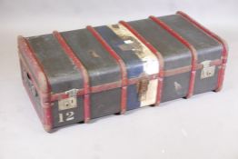 A vintage wood strapped and metal mounted steamer trunk, 21" x 13" x 40"