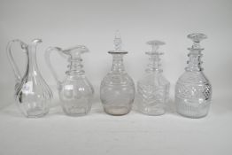 Three Georgian cut glass ring neck decanters, and two Georgian cut glass jugs, 1 A/F, largest 11"