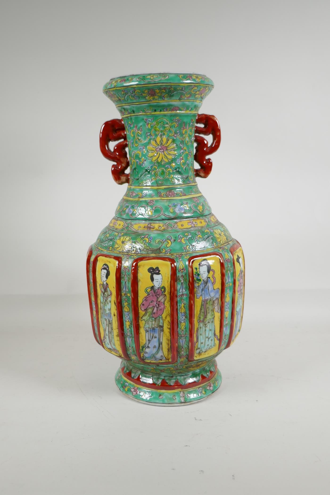 A Chinese polychrome porcelain two handled vase with raised decorative enamelled panels, depicting - Image 3 of 5