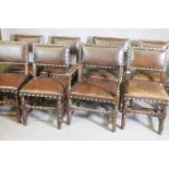 A set of eight antique oak and studded leather dining chairs, 35" high