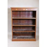 A Victorian  mahogany open bookcase, the top and frieze inlaid with fans and boxwood stringing,