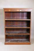 A Victorian  mahogany open bookcase, the top and frieze inlaid with fans and boxwood stringing,