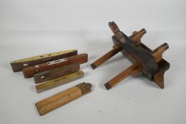 A C19th moulding plane by Buck & Hickman Ltd, London, and four vintage levels and a brass mounted