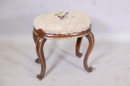 A rosewood and parcel gilt stool with lappeted frieze, raised on cabriole supports with scroll