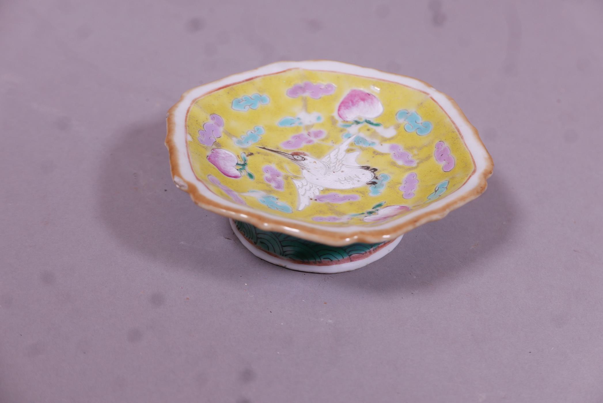 A Chinese Republic ceramic stem bowl with enamel decoration of lotus and birds on a yellow glazed - Image 2 of 3