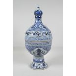 A Chinese blue & white porcelain incense burner & cover, decorated with lotus flowers & the eight