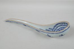 A Chinese blue & white porcelain ladle, with lotus flower decoration to the exterior and all over