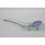 A Chinese blue & white porcelain ladle, with lotus flower decoration to the exterior and all over